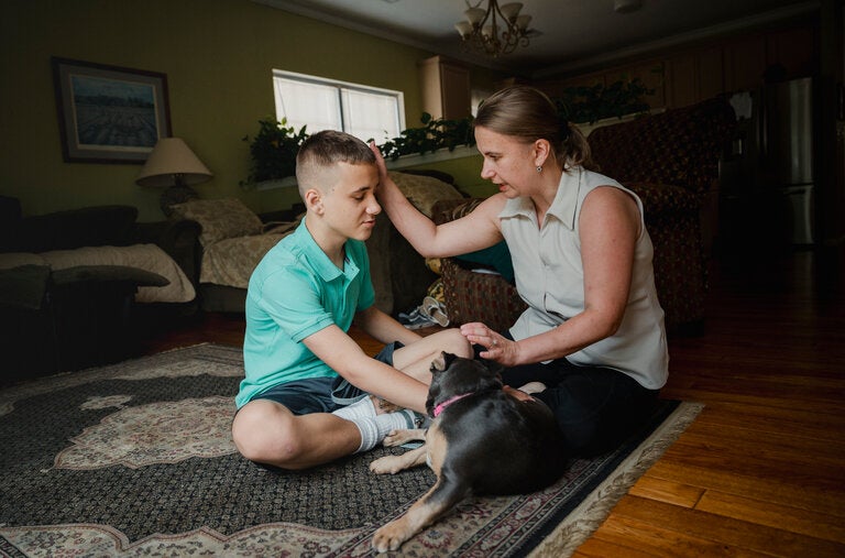 Anna Lazos with her son and their dog. After spending thousands of dollars on cord blood storage, Ms. Lazos asked to withdraw a sample to enroll him in an autism clinical trial. The company told her that the cells were contaminated with E. coli.