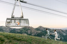 Joseph Gorman, left, and Matt Capbarat were married June 29 at High Camp at the Palisades Resort, Olympic Valley, Calif. They had to make a dash to get a photo with the tram in the background.