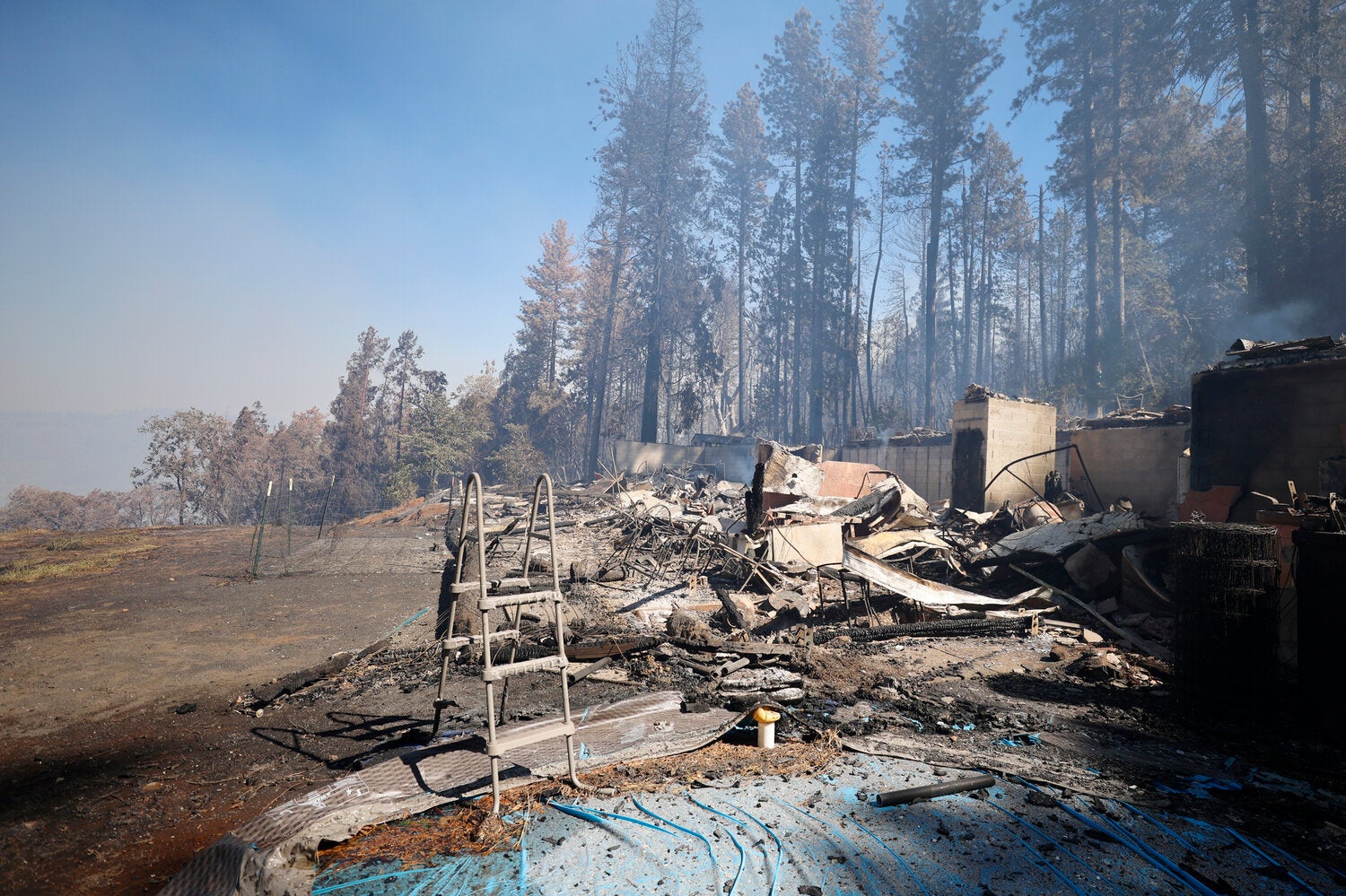 A home that was destroyed by the Park fire overlooks a canyon in the Forest Ranch area near Chico, Calif., on Friday.