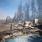 A home that was destroyed by the Park fire overlooks a canyon in the Forest Ranch area near Chico, Calif., on Friday.