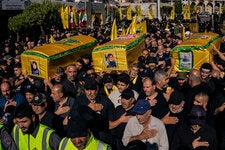 Hezbollah members and supporters mourned the deaths of Amer Dagher and his two sisters, Fawzia and Taghreed, who were killed in their home in an Israeli attack on July 15.