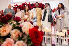 On July 20, Sammi Cannold and Safi Rauf were married before 300 guests in Glenwood, Iowa. His father, Haji Abdul Rauf, an imam, second from right, led the Muslim marriage ceremony. The bride’s parents, Mitchell Cannold and Dori Berinstein, stand on the far left and far right. The groom’s mother, Hamila Rauf, is second from left.