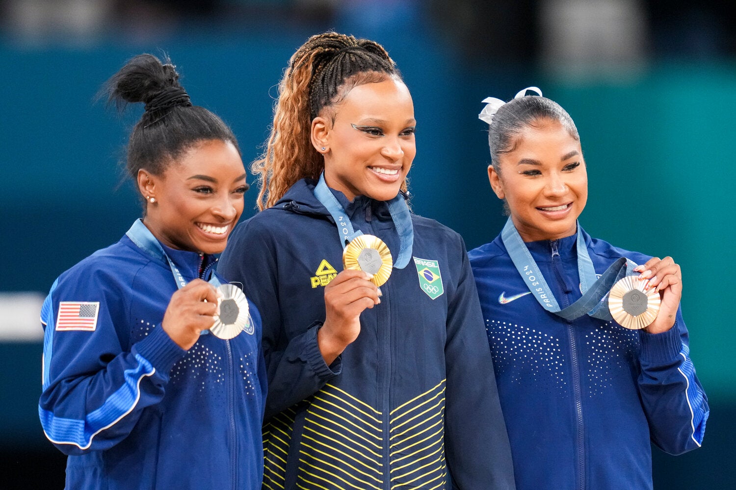 Jordan Chiles, right, with her teammate Simone Biles and Rebeca Andrade of Brazil after the floor exercise.