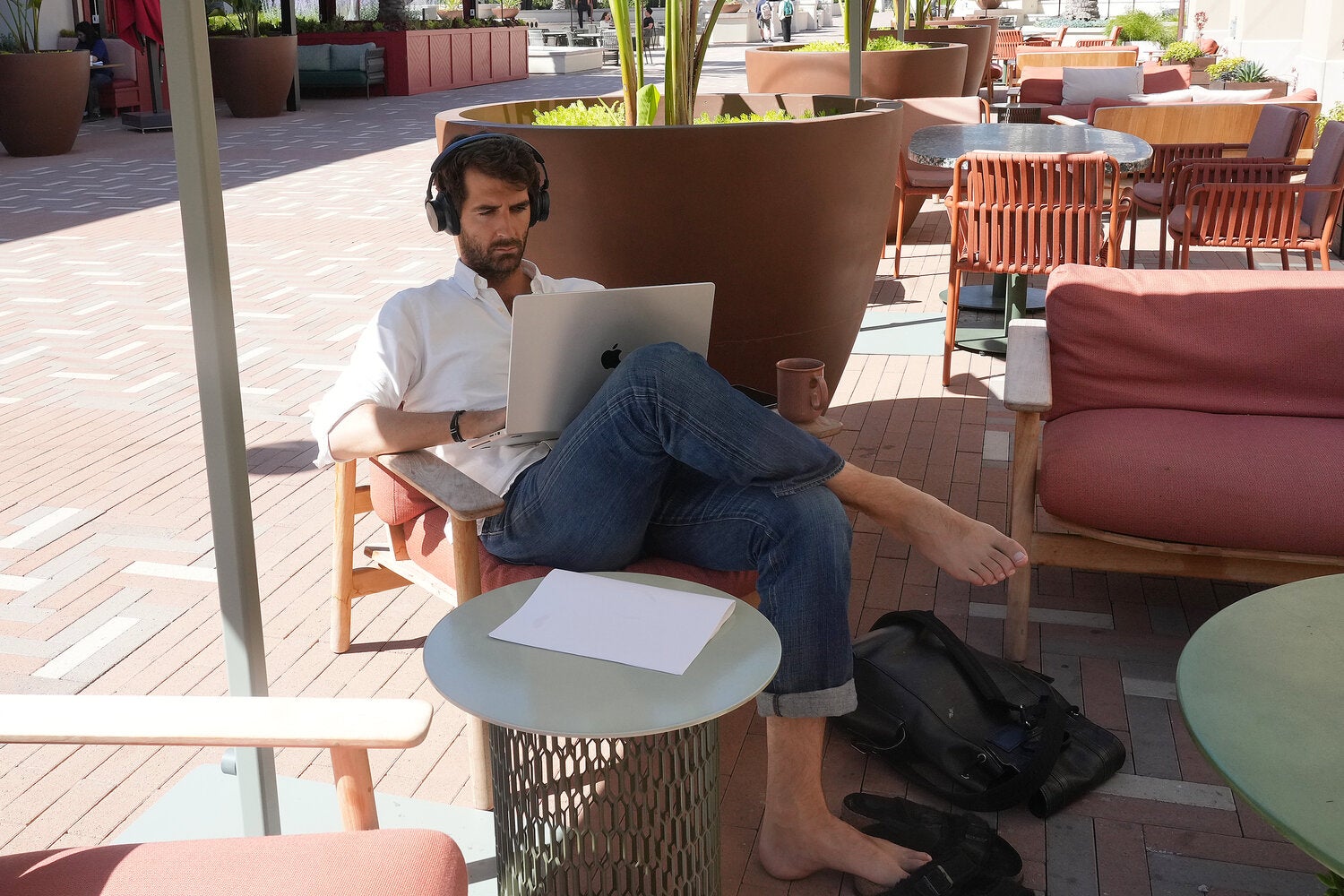 A man working from a co-working space at Springline in Menlo Park, Calif. Springline is a “work resort,” which means its office space designs have taken a page from boutique hotels.