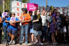 Arizona abortion rights supporters spoke to reporters in Phoenix before submitting petition signatures to get an abortion rights measure on the November ballot.