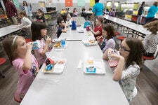 More than 95,000 schools serve free lunches to 28.6 million students each day, and there are calls to expand that.