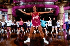 Mr. Simmons in his signature tank top and short shorts leading an exercise class in 1996.