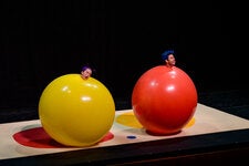 Ms. Gelsone and Mr. Bloom performing a scene from “Air Play” in Nashville in 2018. The show featured balloons, giant swatches of silk and Styrofoam packing peanuts that floated around the theater.