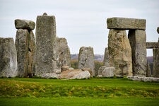 Stonehenge’s inner ring is a horseshoe of five trilithons — two uprights capped by a horizontal lintel — of which three complete ones still stand.