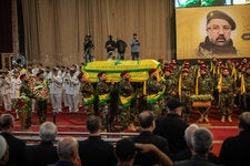 Hezbollah fighters carried the coffin of Fuad Shukr, a senior commander of the group, in Beirut, Lebanon. He was assassinated in an Israeli airstrike on July 30 in the southern suburbs of Beirut.