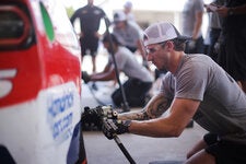 Top racing teams have found that former college football players often make the best prospects for their pit crew teams.