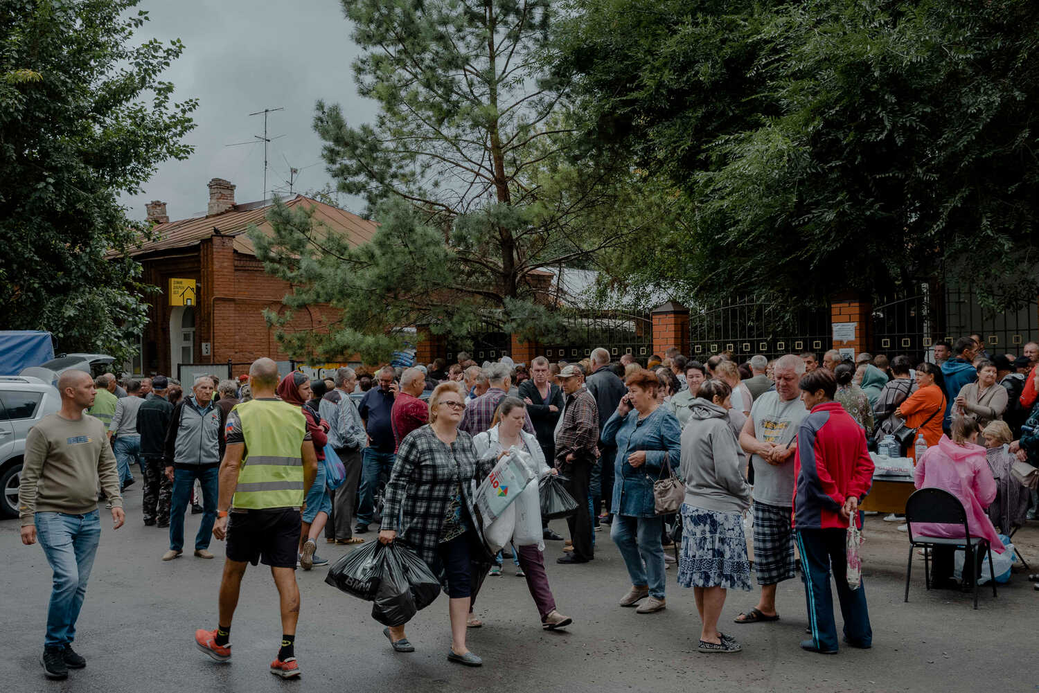 Russians displaced from the border regions waited for aid on Tuesday in Kursk.