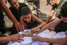 Khaled Joudeh bade farewell to his baby sister, Misq, at the morgue in a hospital in Deir al-Balah, central Gaza, in October.