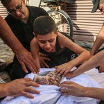 Khaled Joudeh bade farewell to his baby sister, Misq, at the morgue in a hospital in Deir al-Balah, central Gaza, in October.