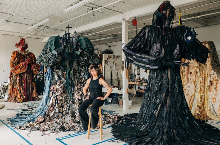 Tau Lewis in her Brooklyn studio, among the giant figures — each about 12 feet tall — that will be part of her first museum show, in Boston.