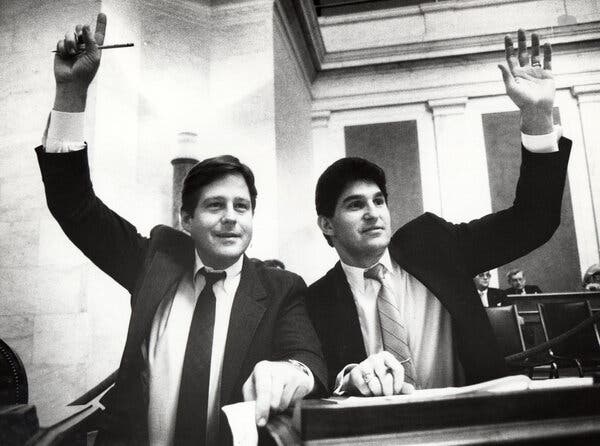 George Blackburn Warner Jr. and Joe Manchin, each raising a hand.