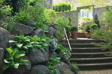 To help create a sense of enclosure in his Sea Cliff, N.Y., garden, Matthew Axe erected a wall of lattice panels.