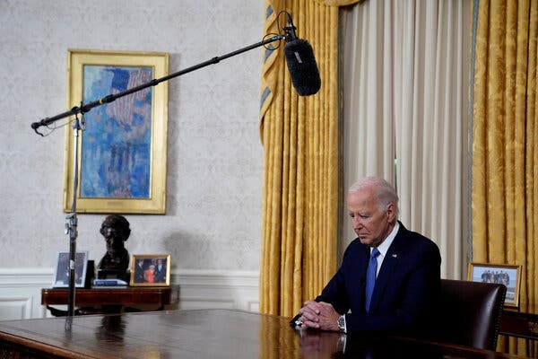 Biden with his head lowered.