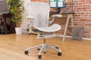 A white Herman Miller Aeron office chair.