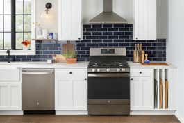 Front view of a GE freestanding gas range in a kitchen.