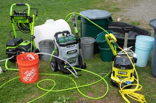 multiple cordless pressure washers in a lawn