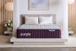 A Purple Rejuvenate mattress staged in a hotel-like bedroom.